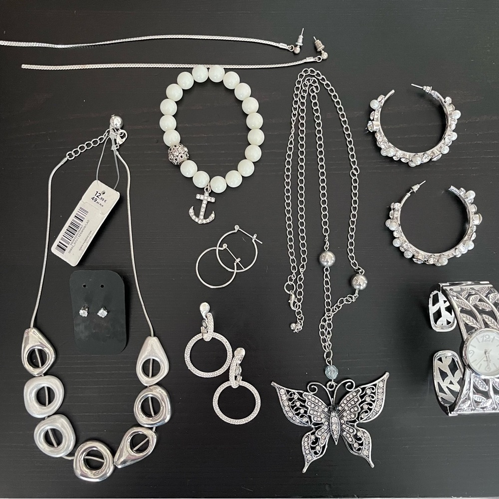 Assorted silver and white jewelry